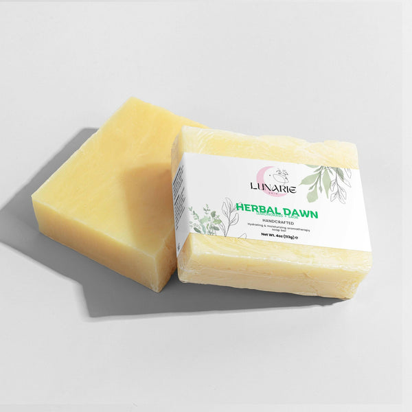 Two bars of Lunarié skincare soap with a label on a light gray background